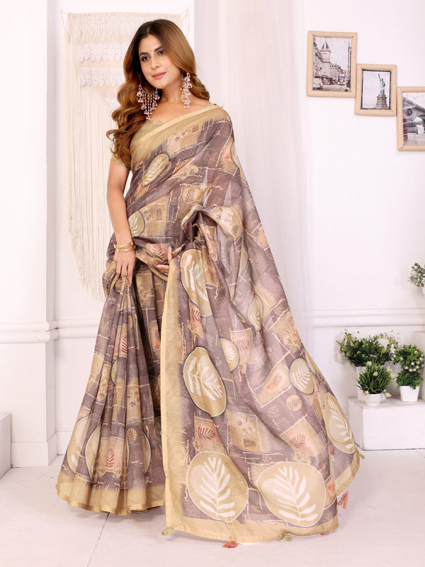 Woman wearing a patterned saree in a room with white walls and decorative elements.
